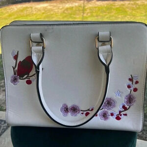 Purse with cardinal embroidery